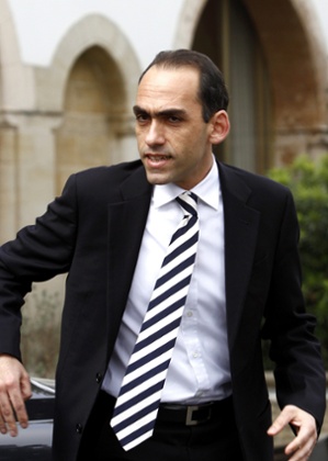 The new Cypriot finance minister Harris Georgiades says Cyrpus will implement its memorandum of understanding fully.