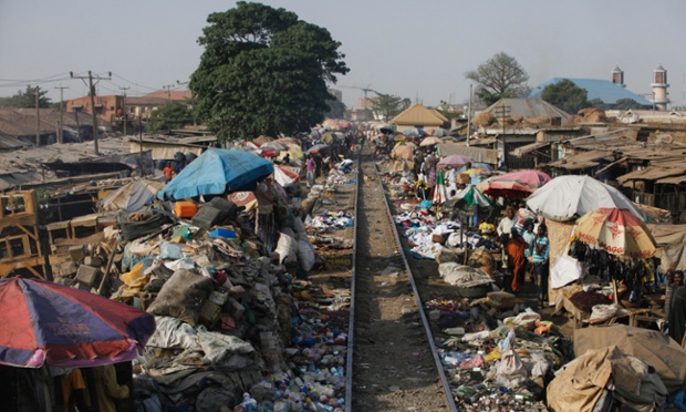 The Lagos to Kano rail track passes through the central market in Kaduna, Nigeria.