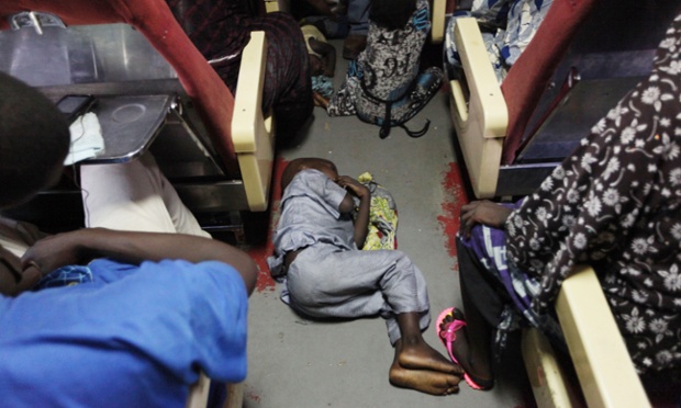 A child sleeps on the floor aboard an Ooni of Ife train to Kano, Nigeria.