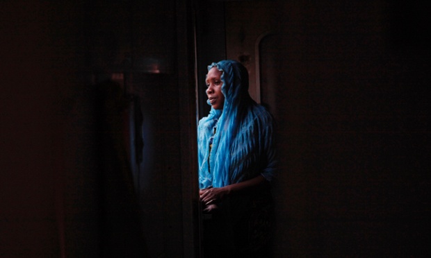 A passenger rides aboard an Ooni of Ife train to Kano, Nigeria.