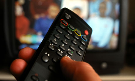 Hand holding remote control