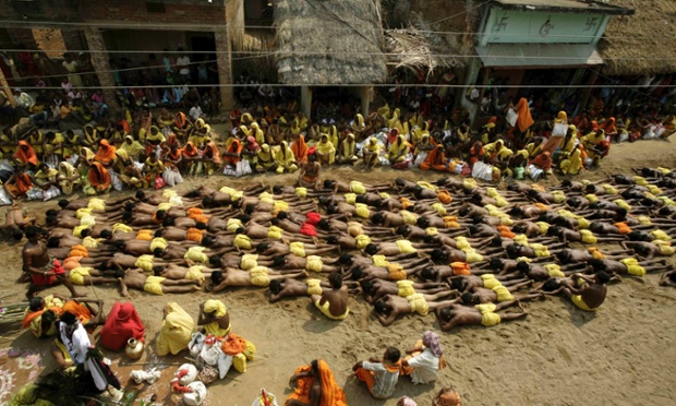 Another day, another festival. It's the second day of the Danda festival, or the festival of self-punishment, at Kulagarh in Ganjam district, Orissa state, India. Devotees perform rituals of penance on hot sand to appease Shiva, the Hindu god of destruction during the 21-day long festival, in which only males participate.