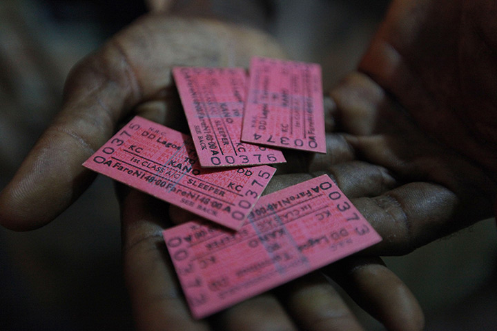 FTA: Sunday Alamba: A man shows his train tickets to Kano. The cheapest train ticket available 