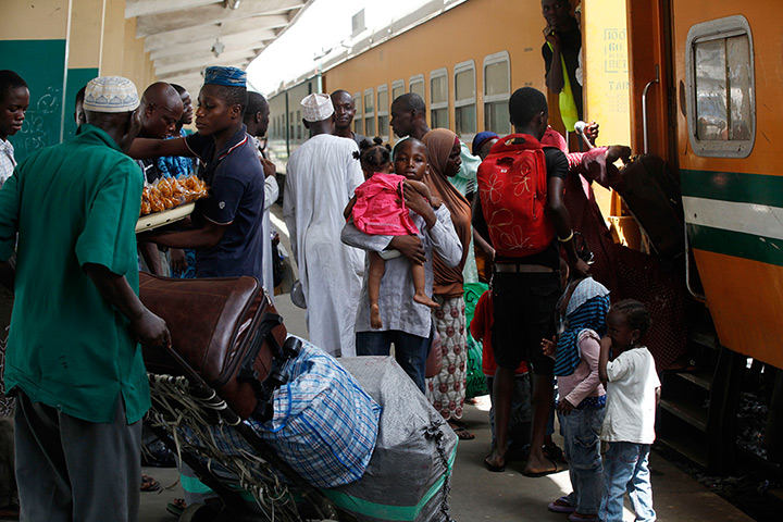 FTA: Sunday Alamba: Passengers board an Ooni of Ife train to Kano, in Lagos, Nigeria