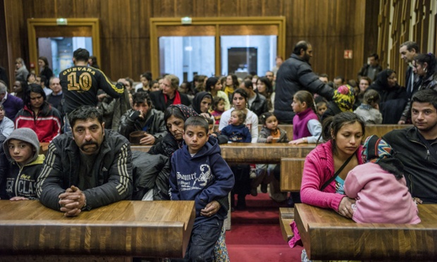 People of the Roma community who were evicted from their camp wait at an administrative court in Lyon, France, prior to a hearing regarding the ruling on their eventual rehousing.
