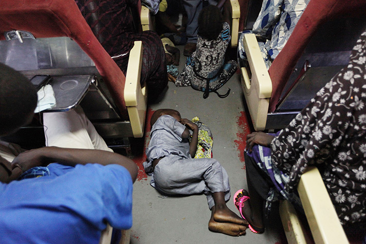 FTA: Sunday Alamba: A child sleeps on the floor onboard the train