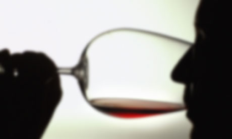 silhouette of a person drinking red wine