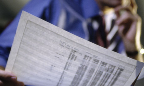 businessman looking at a spreadsheet