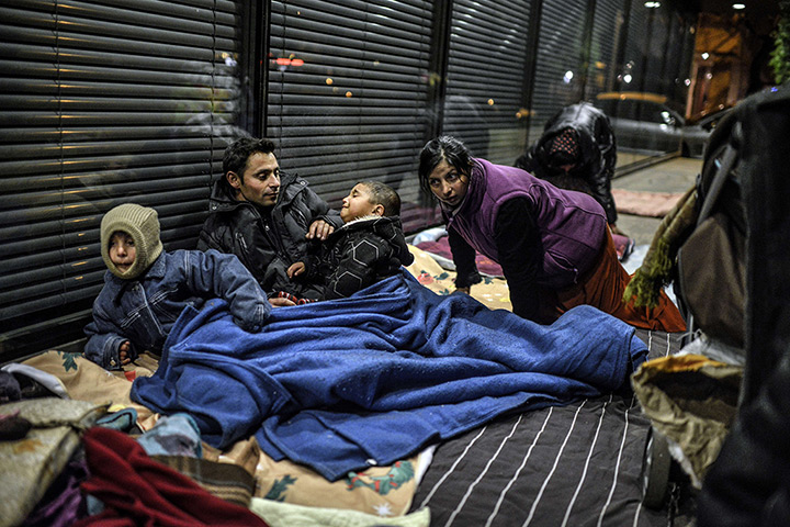 24 hours in pictures: Lyon, France: People of the roma community, who were evicted from their cam