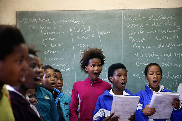 24 hours in pictures: Qunu, South Africa: Children practice singing at the Qunu Junior Secondary 