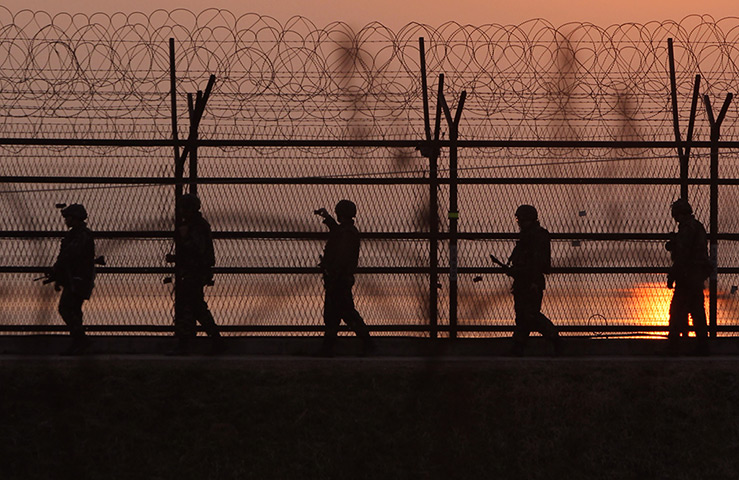 Korea tensions: South Korean soldiers patrol inside the barbed-wire fence 
