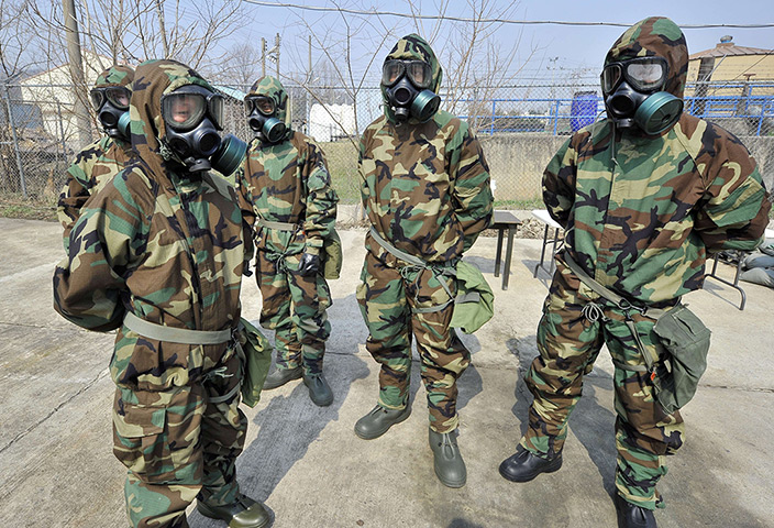 Korea tensions: Soldiers from the US Army's 23rd Chemical Battalion wear protective gear