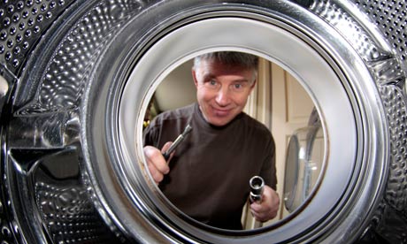 Man fixing washing machine
