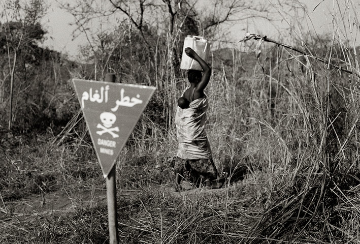 Villager passes warning sign