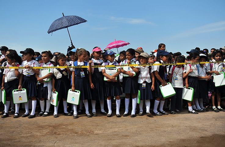 24 hours in pictures: Schoolchildren hold XO notebook computers in  Nicaragua