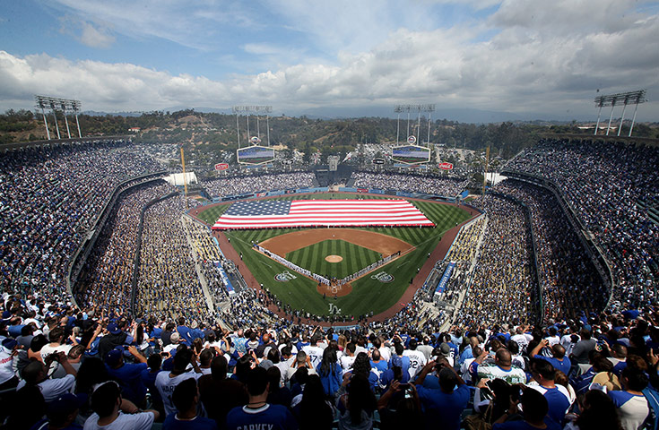 Best of the week: The crowd and participants stand for the national anthem