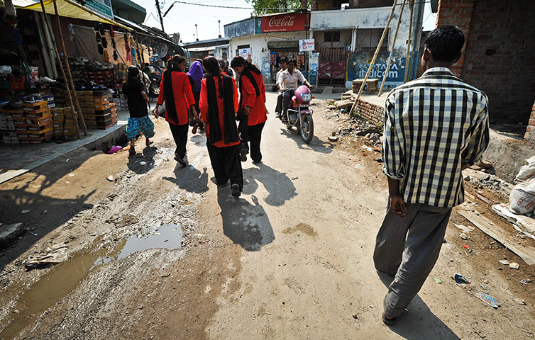 The Red Brigade walk through the Midiyav slum