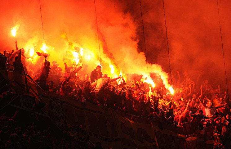 20 Photos: Galatasaray's supporters light flares at the Santiago Bernabeu in Madrid