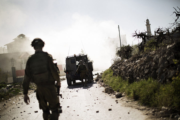 20 Photos: Israeli soldiers during clashes with Palestinian stone throwers