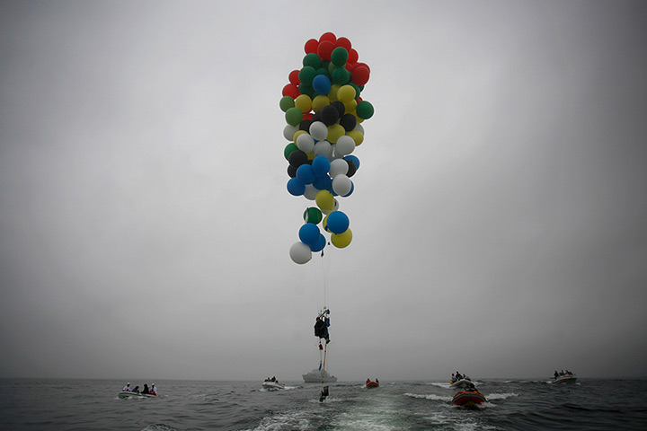 24 hours in pictures: Matt Silver-Vallance floats above the Atlantic Ocean using helium balloons