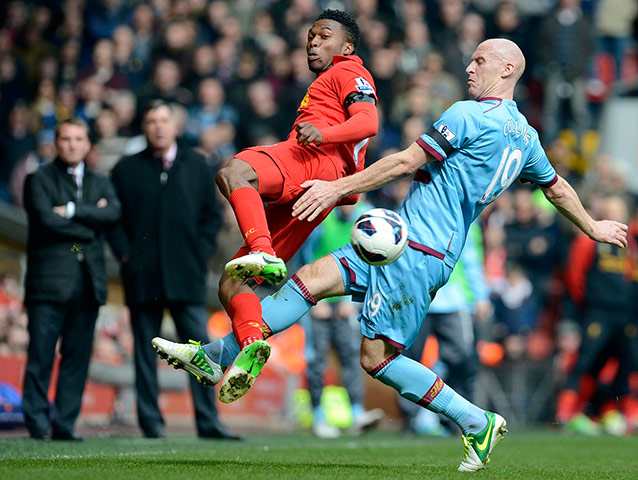 Sunday's matches: West Ham United's Collins challenges Liverpool's Sturridge