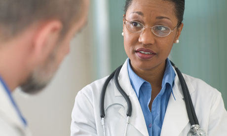 Concerned woman doctor listening to patient