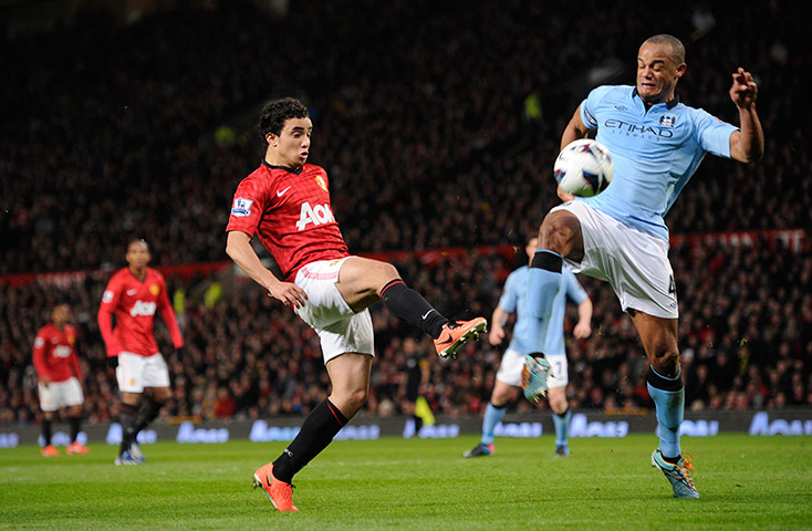 United versus City: Rafael gets the ball past Kompany