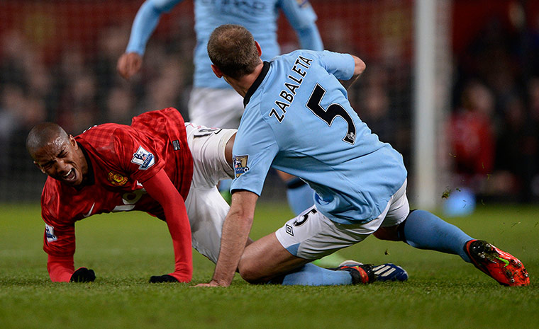 The Manchester derby: Ashley Young is fouled by Pablo Zabaleta and goes off injured 
