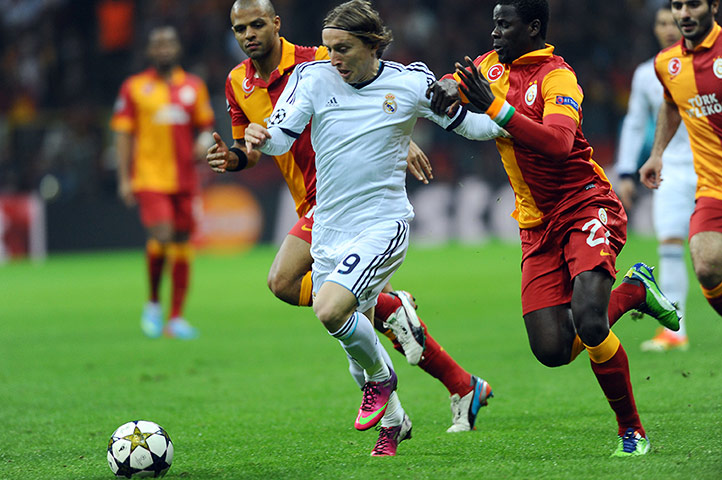 Galatasaray v Real: Real Madrid's Luka Modric skips past Galatasaray's Emmanuel Eboue