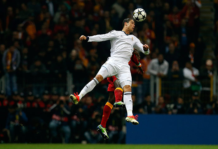 Galatasaray v Real: Ronaldo fights goes up for a header