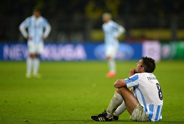 Dortmund against Malaga: Malaga's Jeremy Toulal is dejected