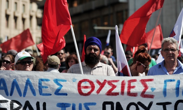 Communist-affiliated protesters and foreign workers gather at a central Athens square during a May Day rally  on May 1, 2013.