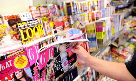 Magazines on a stand in a newsagents