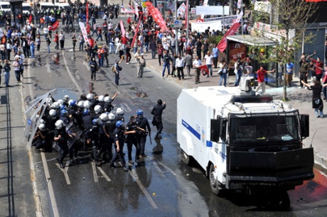 Riot police and protestros clash at a May Day demonstration on May 1, 2013, in Istanbul.  Several people were injured on Wednesday as Turkish riot police used water canon and tear gas to disperse hundreds of protesters who defied a May Day ban on demonstrations in a central part of Istanbul.