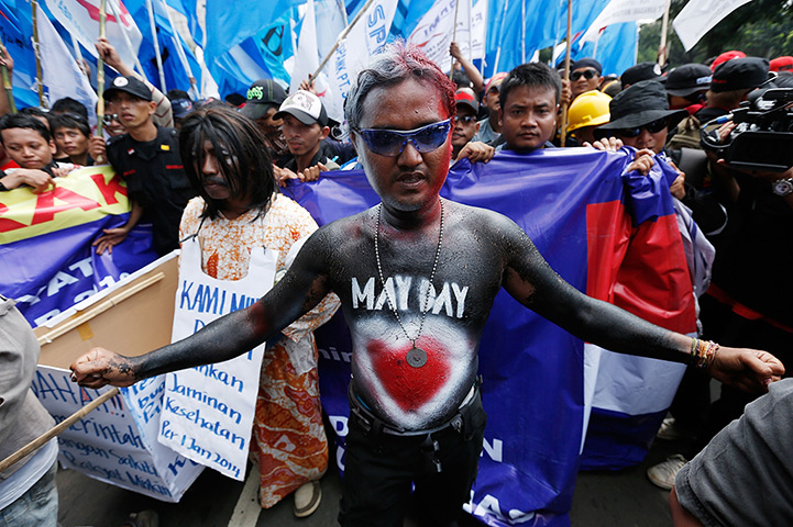 May Day: A May Day demonstrator in bodypaint in Jakarta