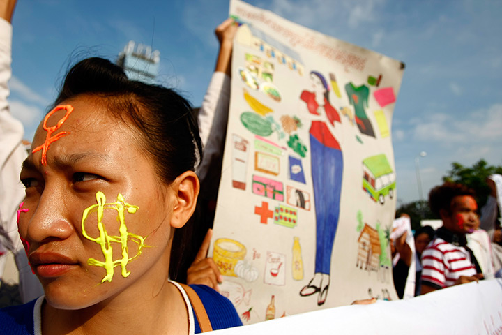 May Day: A Cambodian garment factory worker joins a rally on in Phnom Penh, Cambodia
