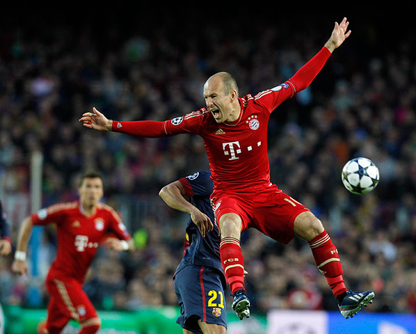 Barca groundstaff: Bayern Munich's Robben is tackled by Barcelona's Adriano
