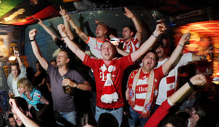 barca v bayern 3: Bayern Munich supporters celebrate in a bar
