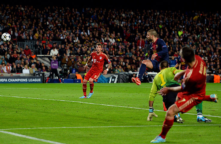 barca v bayern 3: Gerard Pique of Barcelona scores an own goal to make the score 2-0