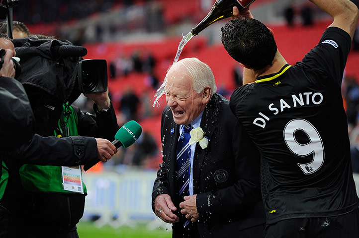 TJ Cup Final 4 : Wigan chairman Dave Whelan is showered in champagne by Franco Di Santo