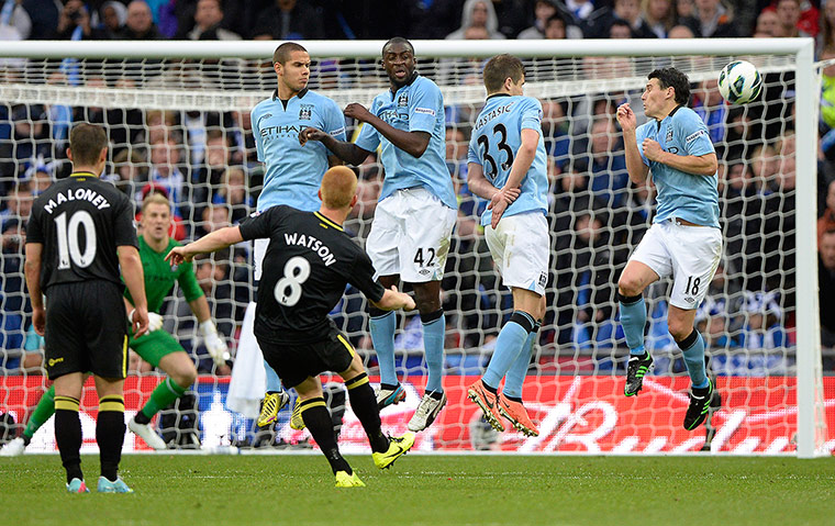 TJ Cup Final 4 : Ben Watson fires a free kick around the Manchester City wall