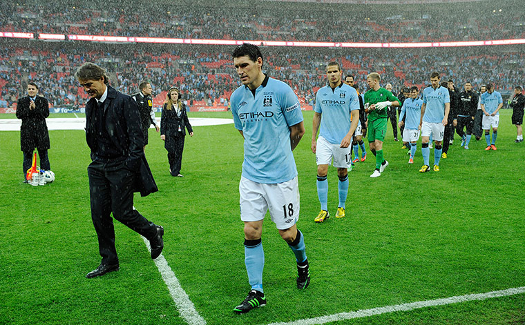 TJ Cup Final 4 : A dejected Mancini and players after the FA Cup Final