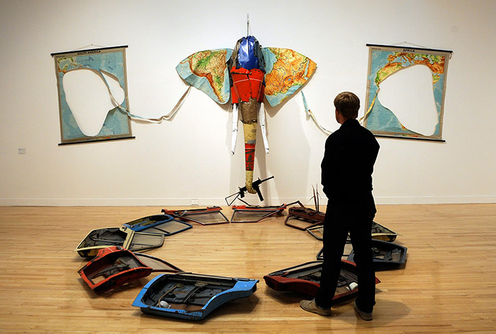 Tate rehang: A gallery employee stands next to the installation Elephant by British scul