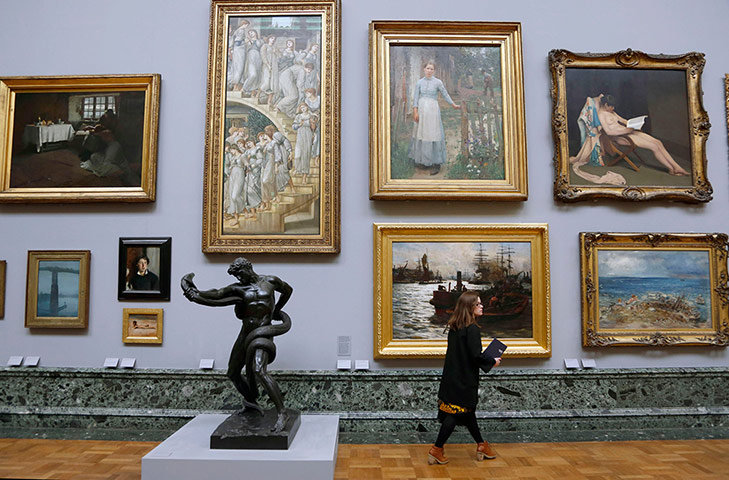 Tate rehang: A woman admires artwork on display 