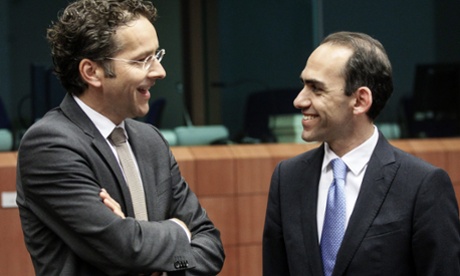 Eurogroup President Dutch Finance Minister Jeroen Dijsselbloem (L) chats with Cyprus finance minister Haris Georgiades at the start of a Eurogroup Finance Ministers meeting at the European Council headquarters in Brussels, Belgium, 13 May 2013.  EPA/OLIVIER HOSLET