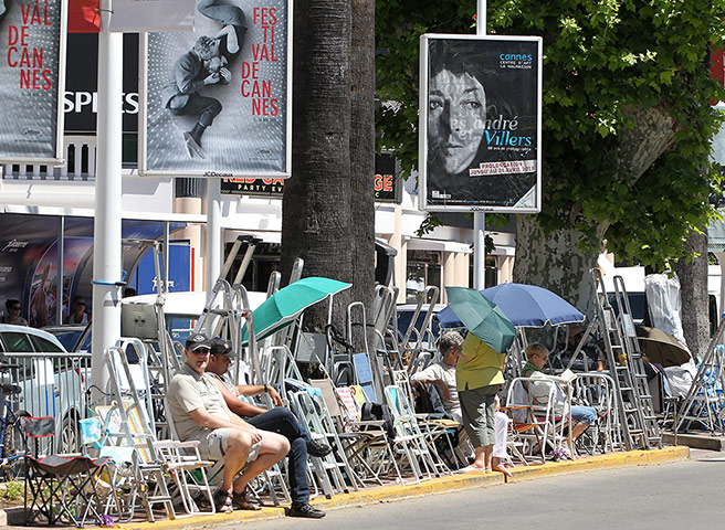 Cannes preparation : Chairs and stepladders are set up for eyeing the stars opposite the Palais 