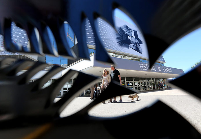 Cannes preparation : A view of the Palais des Festivals through a palm-shaped decoration