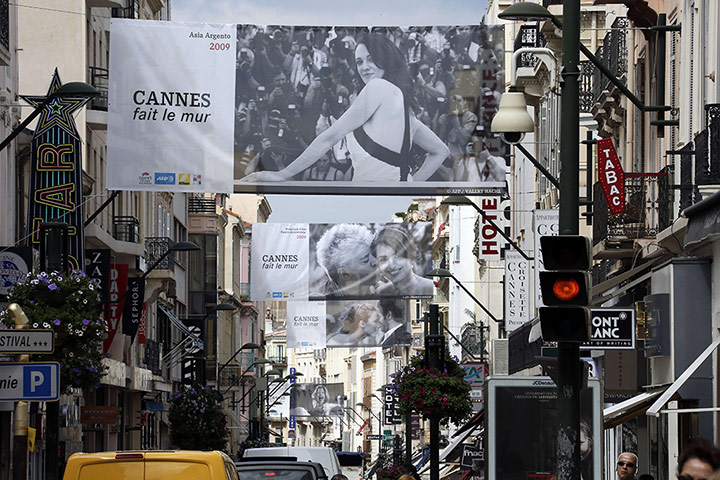 Cannes preparation : Pictures of film stars advertise the festival above the streets in Cannes
