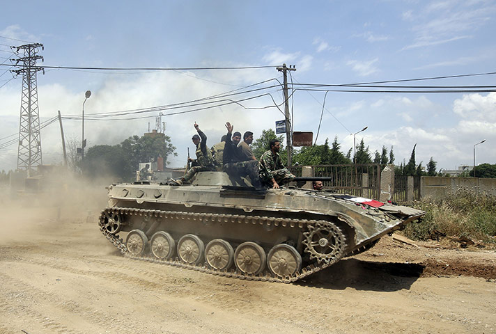 Syrian troops in Homs: Syrian troops retake village in Homs 