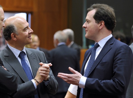 French minister of Economy, Finances and Foreign Trade Pierre Moscovici and British Chancellor of the Exchequer George Osborne (LtR) talk prior to an Economic and Financial Affairs meeting on May 14, 2013 at the EU Headquarters in Brussels